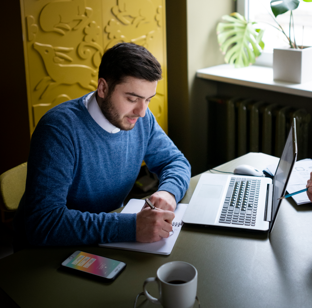 medium shot man working with laptop scaled